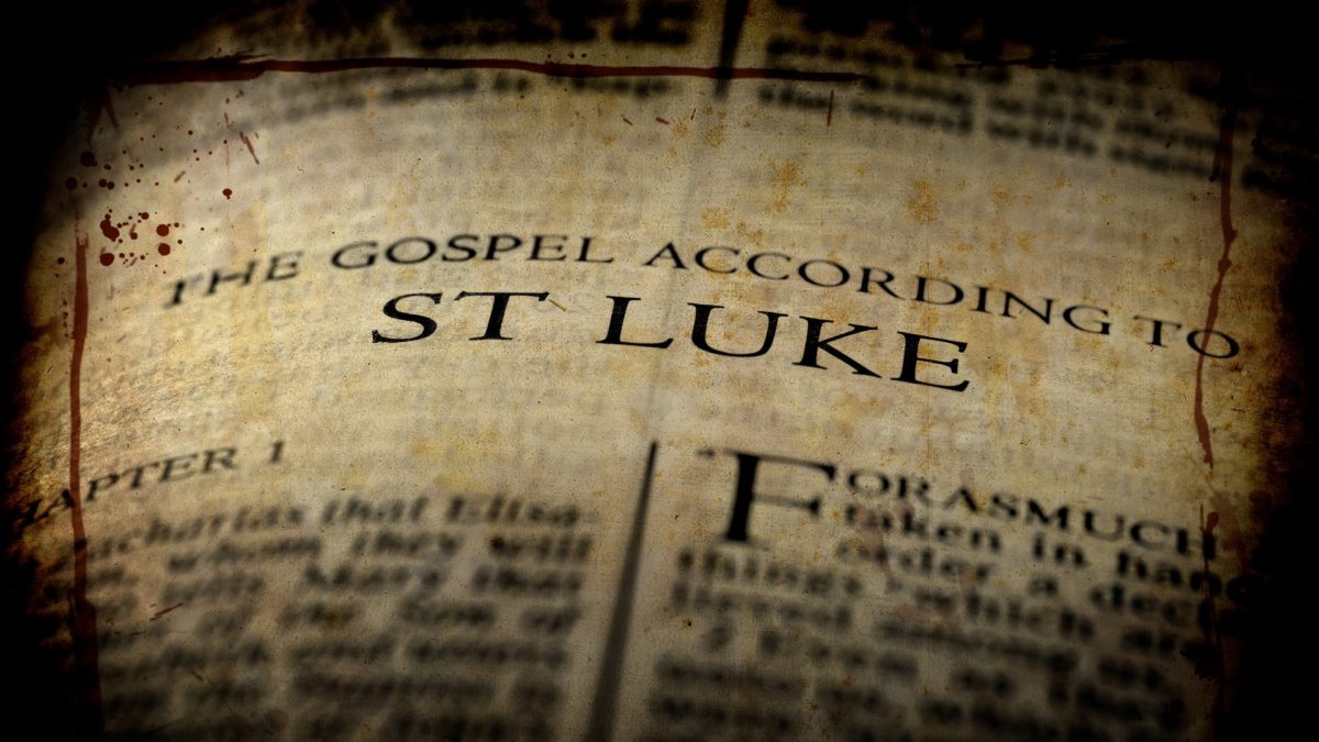Title page of a Bible showing the title "The Gospel According to St. Luke" in sepia with a dark vignette